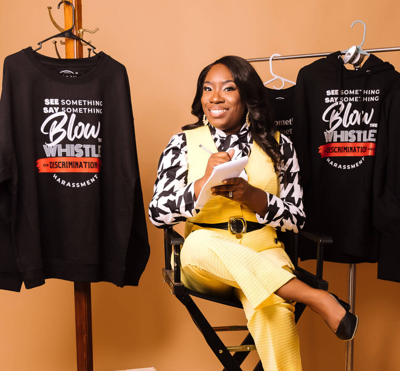 Atty Chiquita Hall-Jackson wearing See Something, Say Something; Blow the Whistle on Discrimination Harassment. Black Hooded Sweatshirt w/ Red & Black printed, Employment Lawyer in Chicago, Employment Lawyer, USA